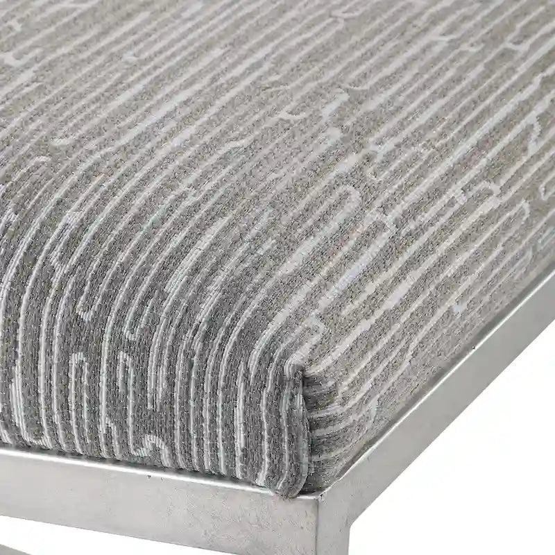 Banc géométrique avec piètement en fer forgé et finition feuille d'argent brossé