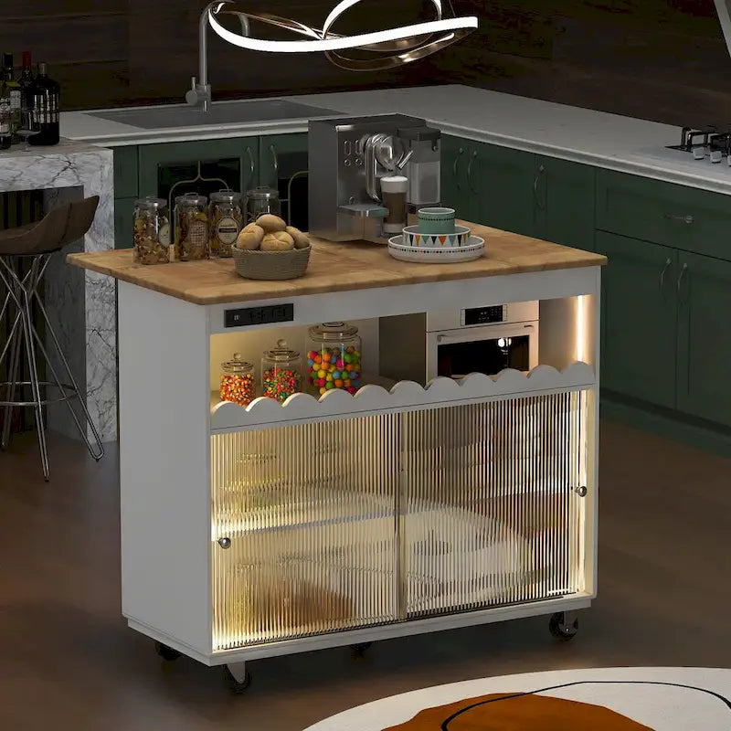 Îlot de cuisine de 112 cm de large avec dessus en caoutchouc à abattant, sur 5 roulettes, avec étagère ouverte et casier à vin